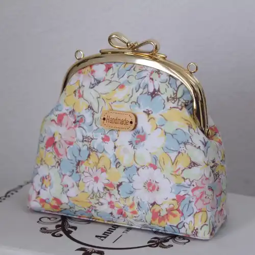 Are there curved metal coin purse frames with unique designs or finishes?